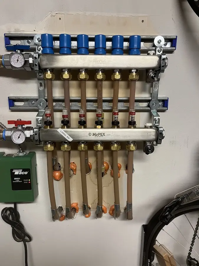 Plumber performing Water Heater Repair at a residential property in Chazy